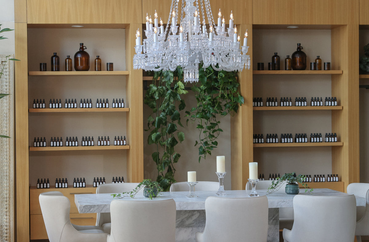 Napa Fragrance boutique interior with crystal chandelier and apothecary bottle shelving