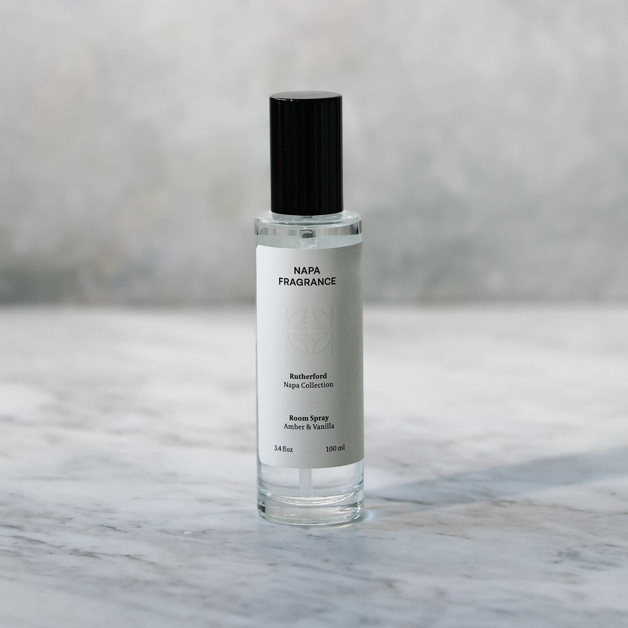 Skincare serum bottle on a marble surface with a blurred background