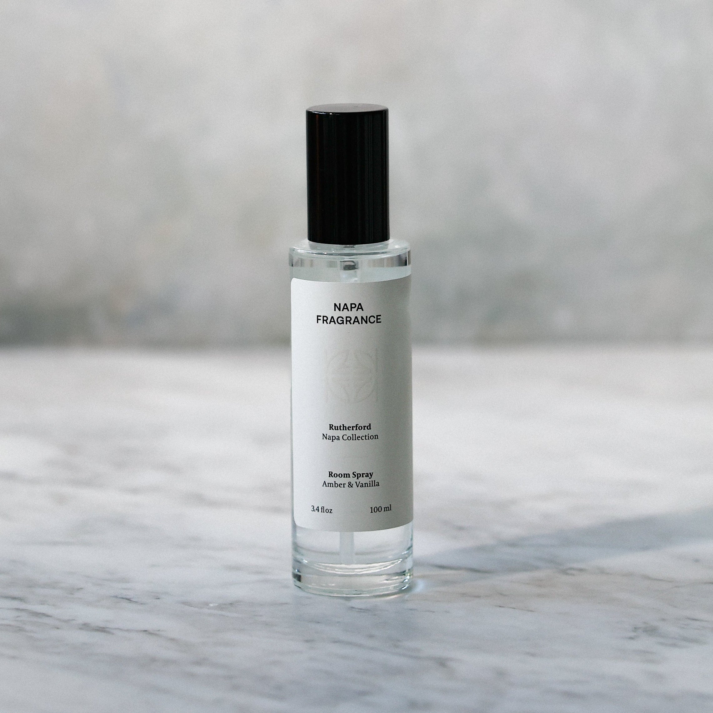 Skincare serum bottle on a marble surface with a blurred background