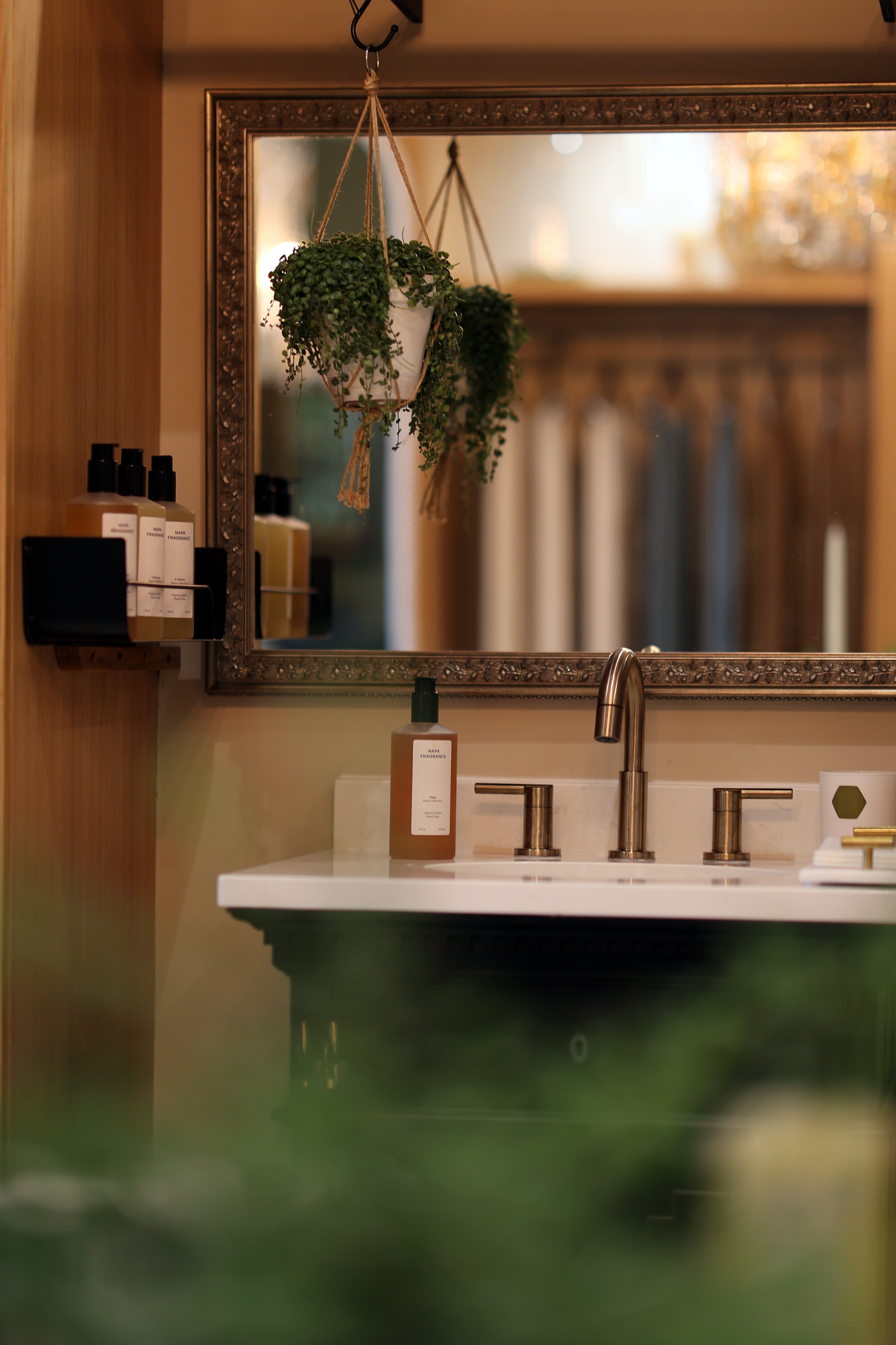 Bathroom vanity with mirror, sink, and decorative elements.